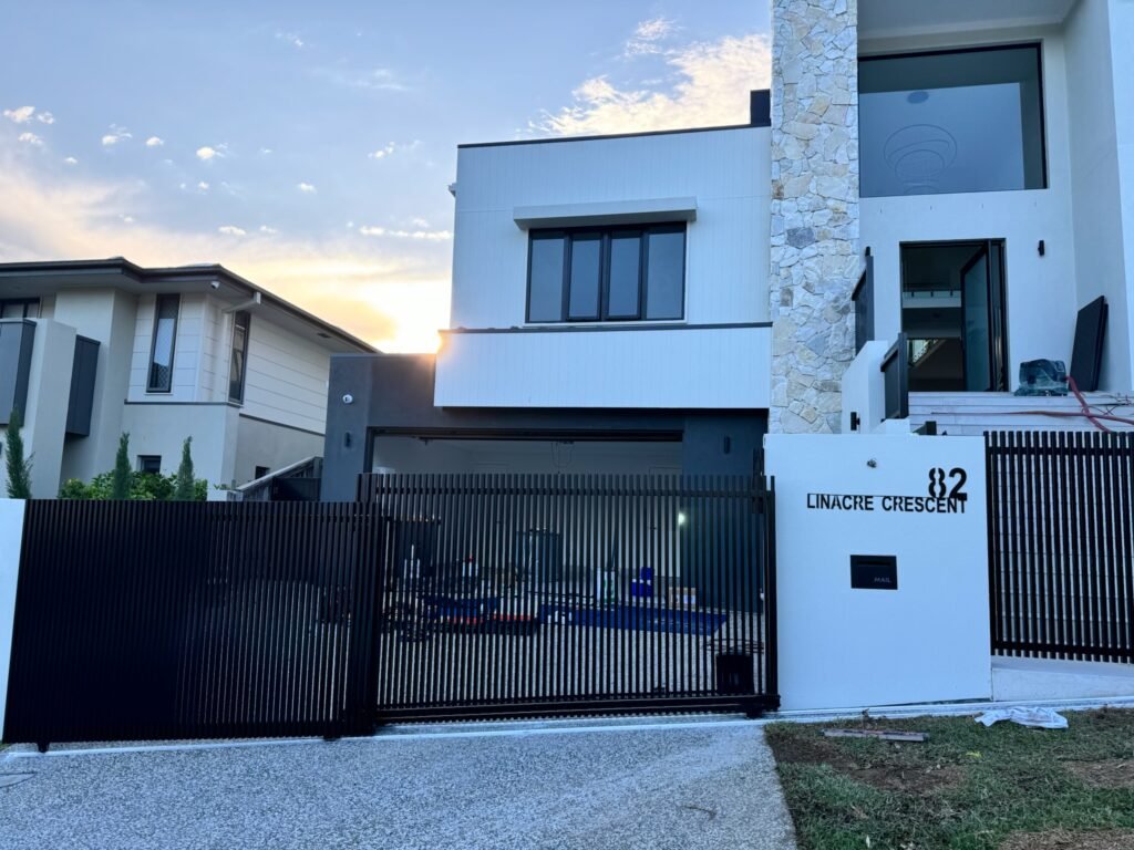 Brisbane Telescopic Gates - Black Batten Style Automatic Driveway Gates and Batten Fence
